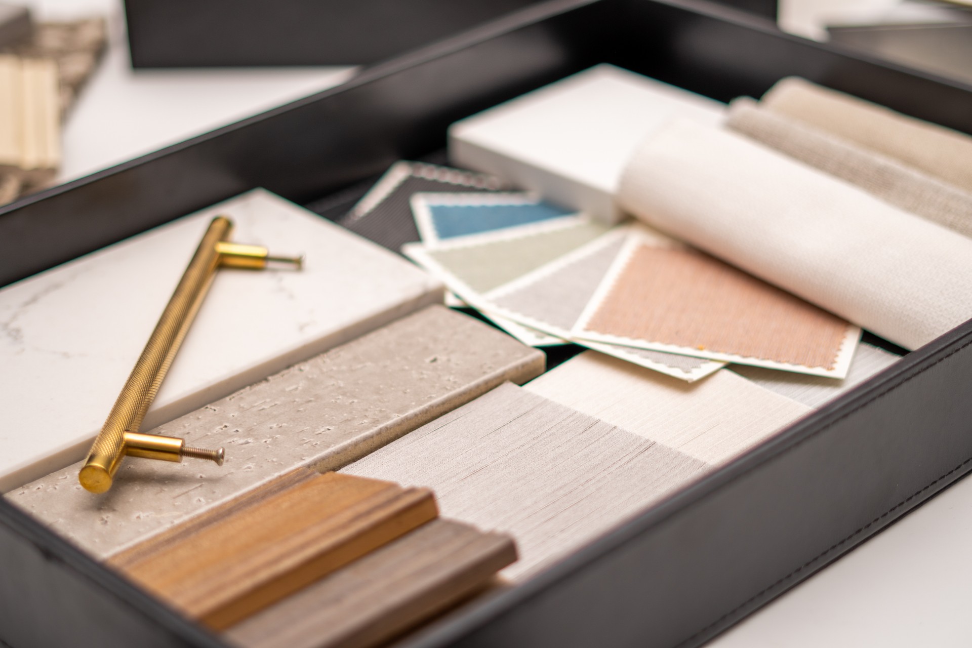 Interior designer's working table, an architectural plan of the house, a color palette